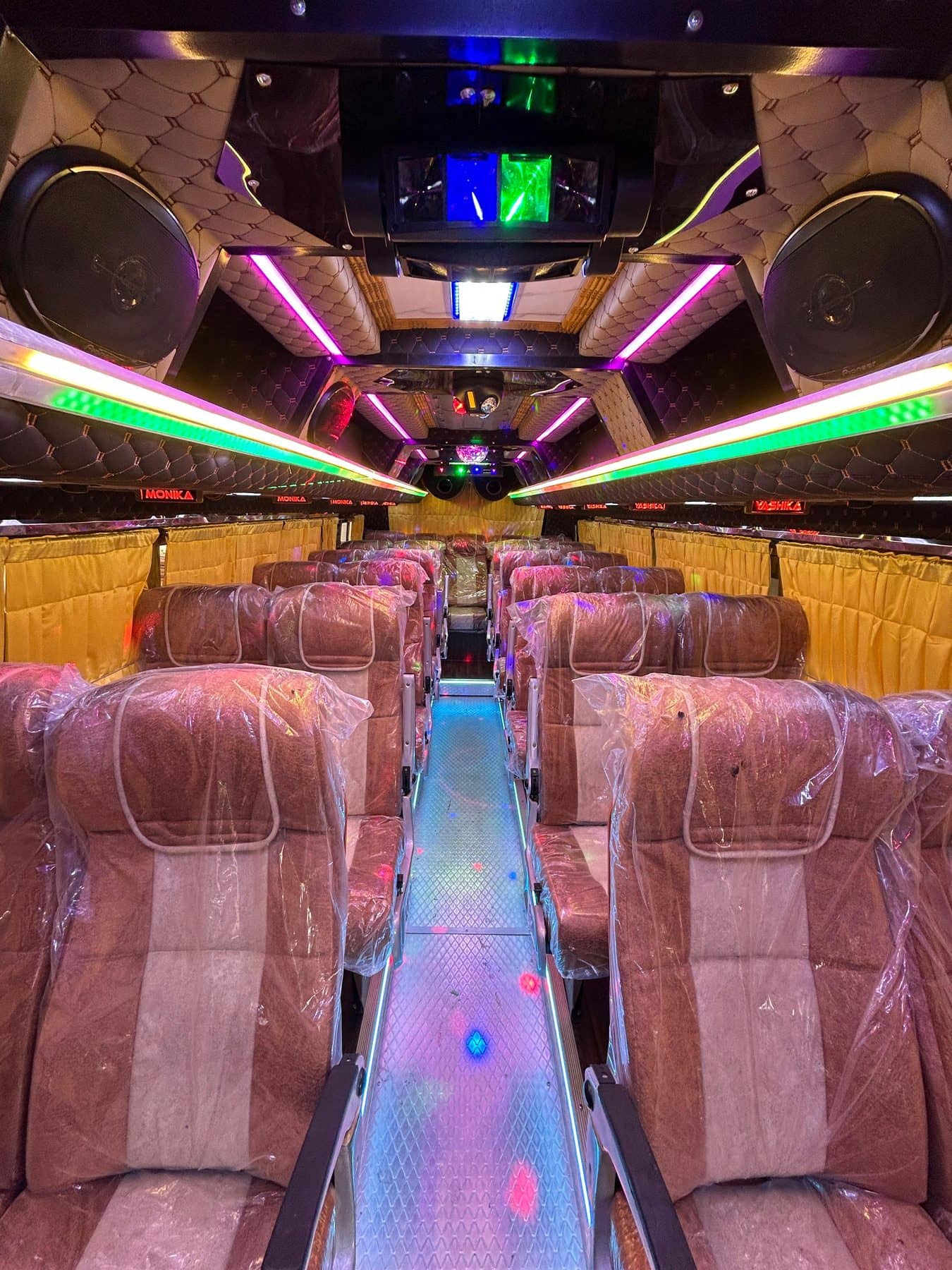 A coach cabin with coloured LED mood lighting