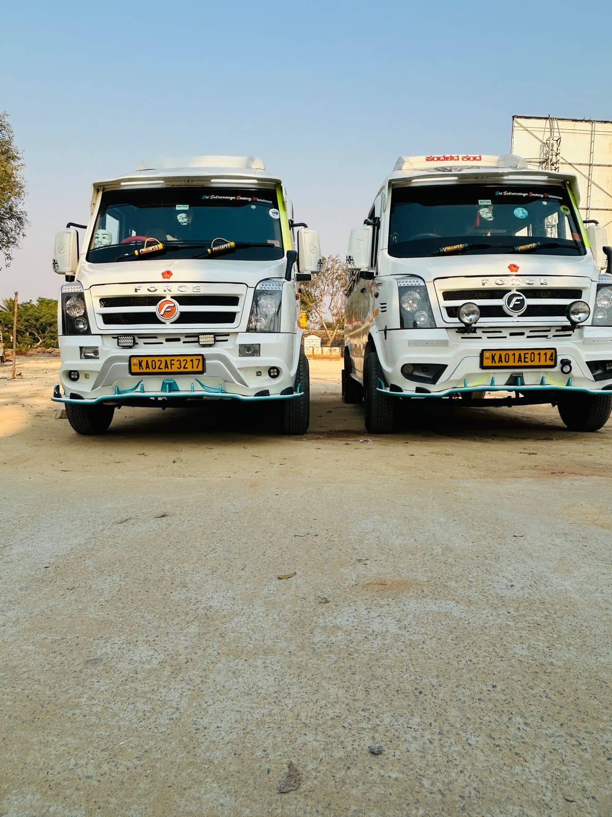 Two Force Tempo Travellers parked side by side, ready for a trip